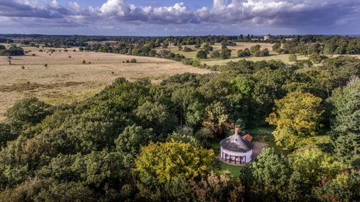 An aerial view of The Round House, with the Ickworth Estate House and parkland in the background, Suffolk